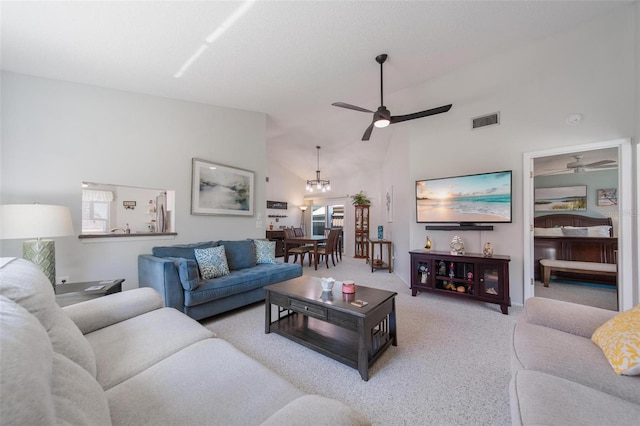 carpeted living room featuring high vaulted ceiling, visible vents, and ceiling fan