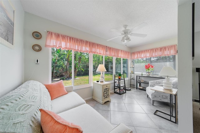 sunroom / solarium featuring ceiling fan