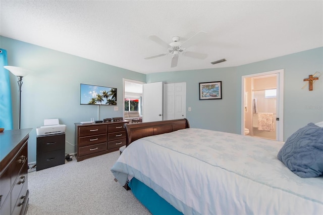 bedroom with ceiling fan, a textured ceiling, carpet flooring, visible vents, and a closet