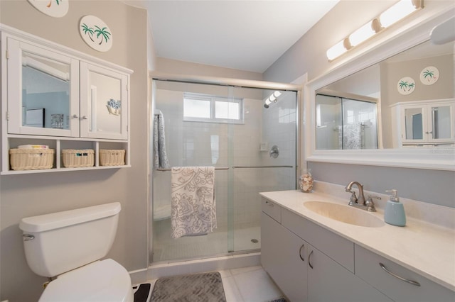 full bathroom featuring a stall shower, vanity, and toilet