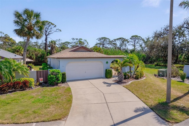 view of front of house with driveway, an attached garage, a front lawn, and stucco siding