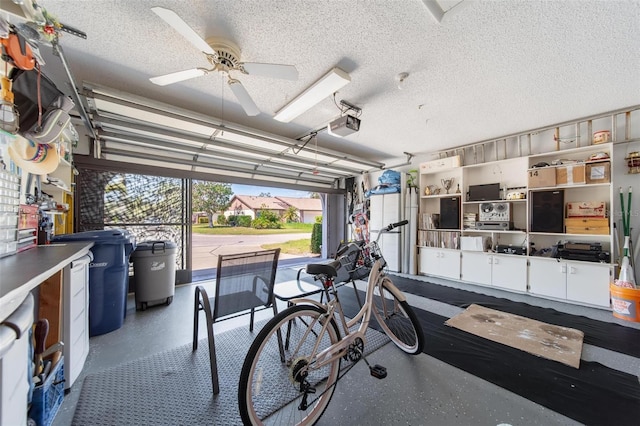 garage featuring a ceiling fan and a garage door opener