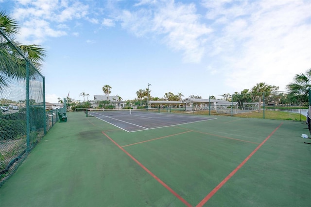 view of sport court featuring fence