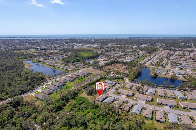 bird's eye view featuring a residential view and a water view