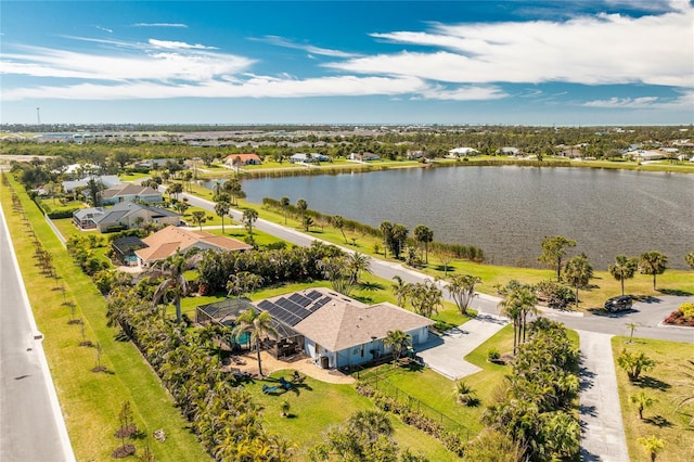drone / aerial view featuring a residential view and a water view