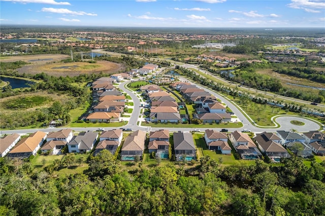 aerial view with a water view and a residential view