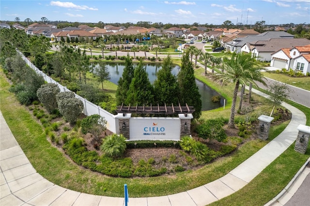 community / neighborhood sign with a residential view, a water view, and fence