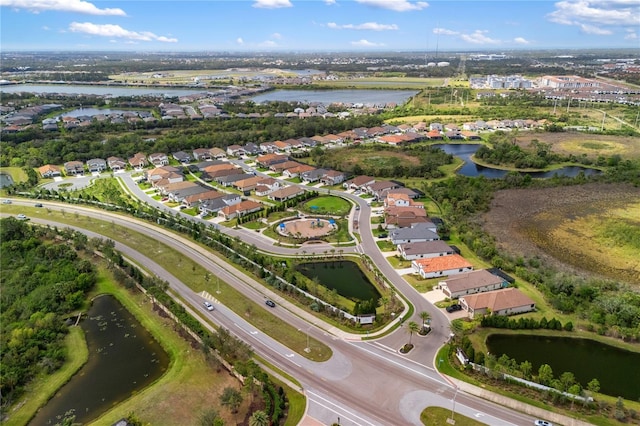 bird's eye view with a residential view and a water view