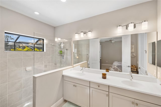 full bath featuring double vanity, walk in shower, a sink, and ensuite bathroom