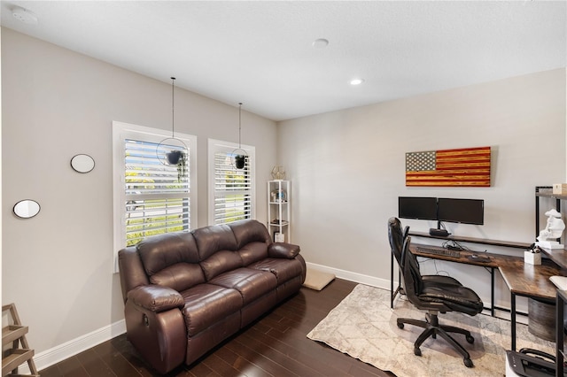 office space with recessed lighting, dark wood finished floors, baseboards, and a baseboard radiator