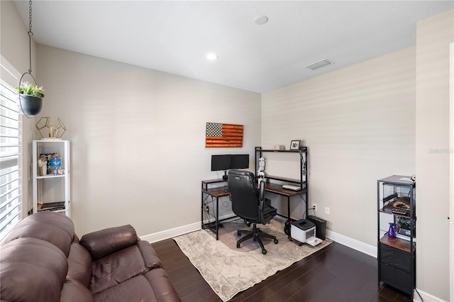 office space with baseboards, visible vents, dark wood-style flooring, and recessed lighting