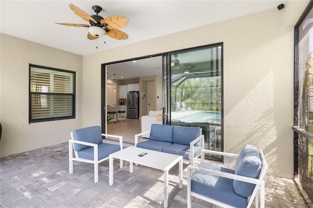 view of patio featuring an outdoor living space and a ceiling fan