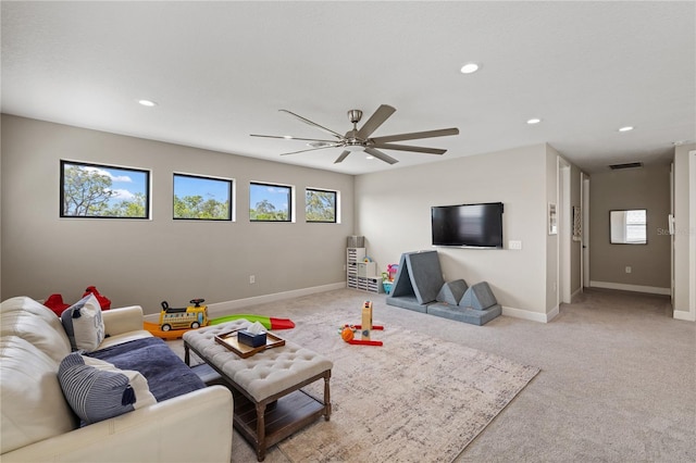 living area with ceiling fan, recessed lighting, light carpet, visible vents, and baseboards