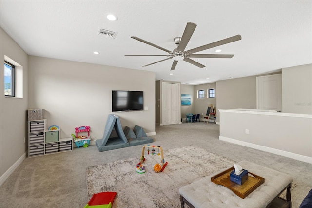 rec room featuring baseboards, recessed lighting, carpet flooring, and a healthy amount of sunlight