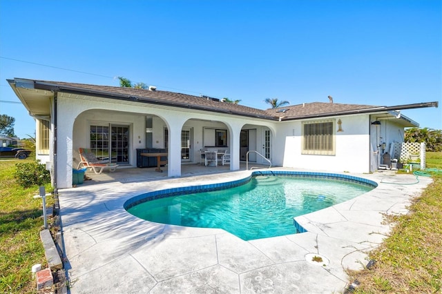 pool with a patio