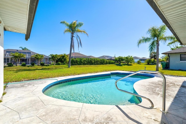 outdoor pool featuring a patio and a lawn