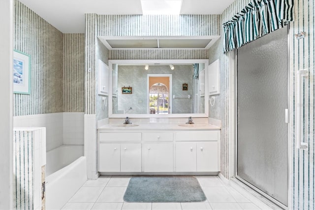 full bath featuring wallpapered walls, tile patterned flooring, and a sink