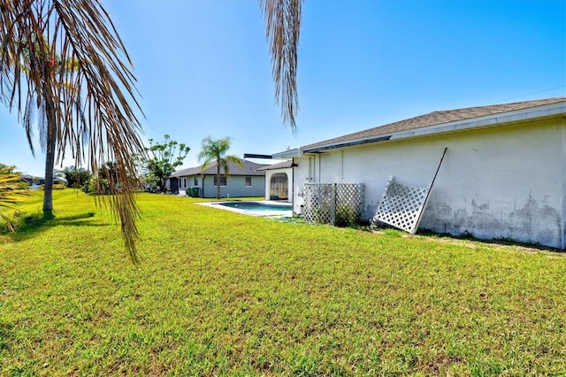 view of yard with an outdoor pool