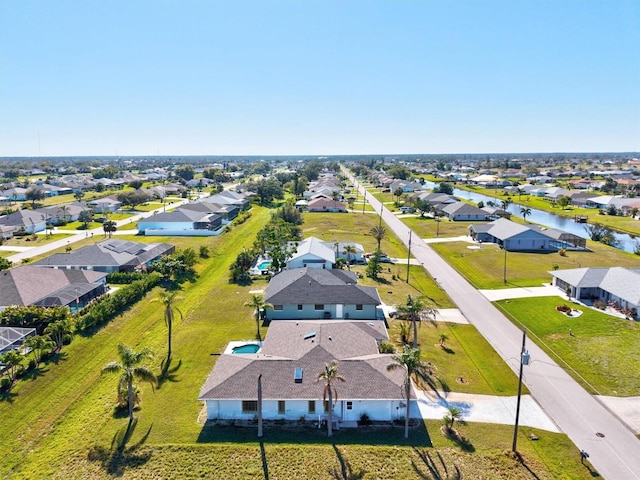 birds eye view of property with a residential view