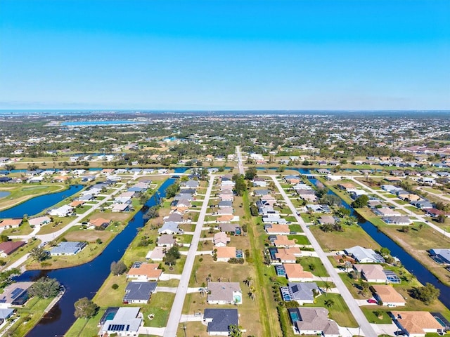 bird's eye view featuring a residential view and a water view