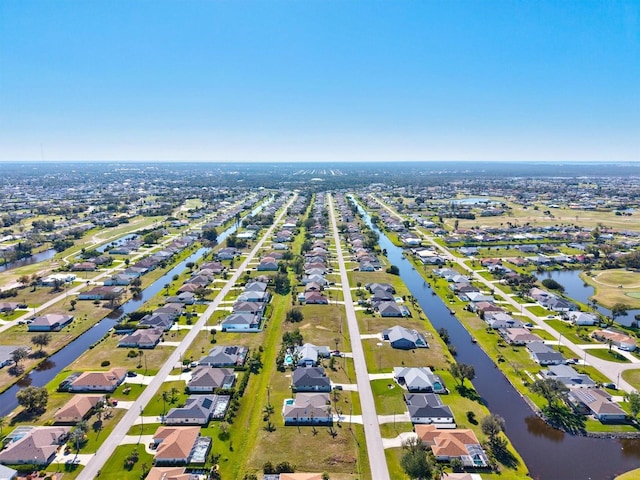 bird's eye view with a residential view and a water view