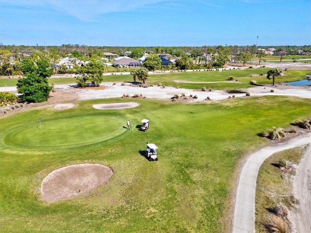 bird's eye view with view of golf course