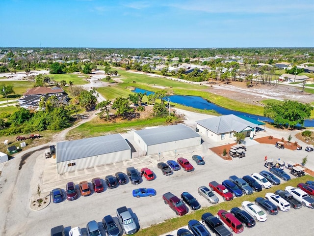 bird's eye view with view of golf course and a water view