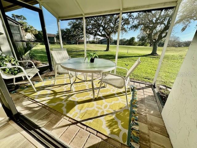 sunroom / solarium featuring a healthy amount of sunlight