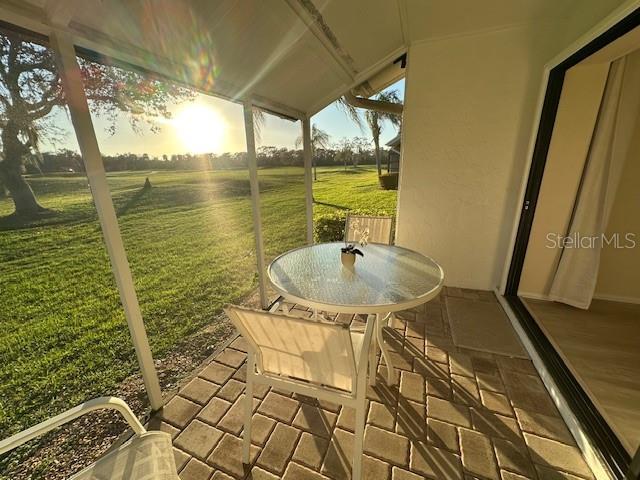 exterior space with a sunroom and a patio