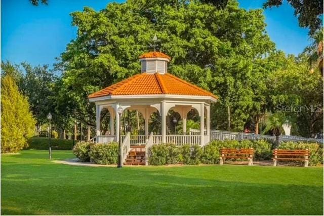 view of home's community with a lawn and a gazebo