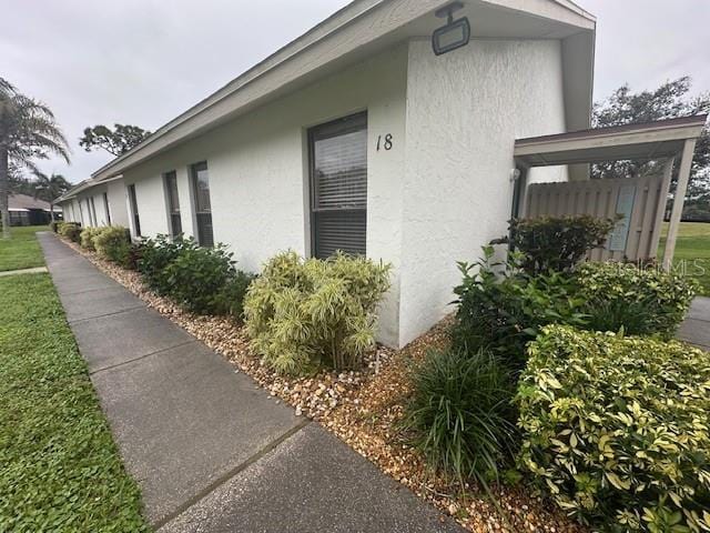 view of home's exterior with stucco siding