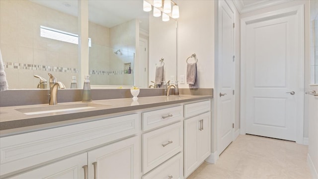 bathroom with double vanity, a sink, and walk in shower