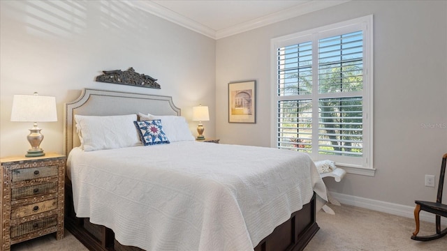 carpeted bedroom featuring crown molding and baseboards