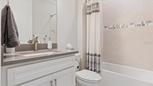 full bath featuring shower / bath combo, vanity, and toilet