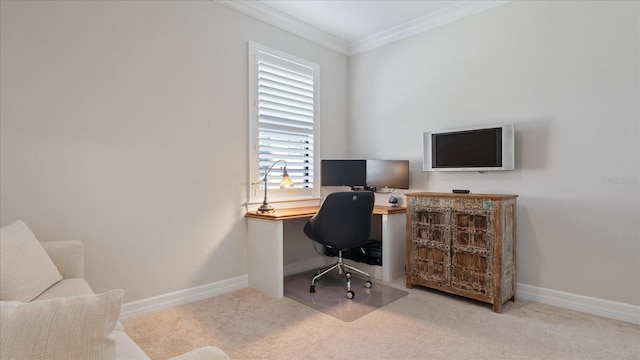 carpeted office space with ornamental molding and baseboards