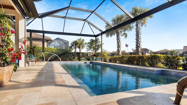 pool with a lanai and a patio