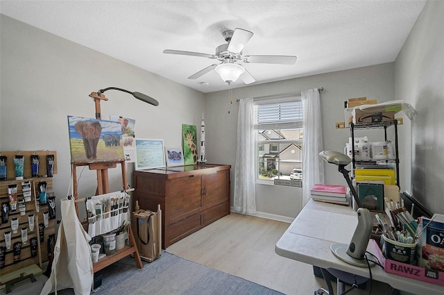 home office featuring ceiling fan and wood finished floors