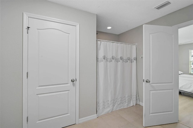 full bath with a shower with curtain, ensuite bath, and visible vents