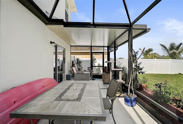 sunroom / solarium featuring plenty of natural light