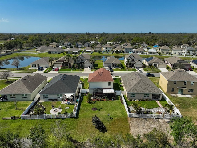 bird's eye view with a residential view and a water view