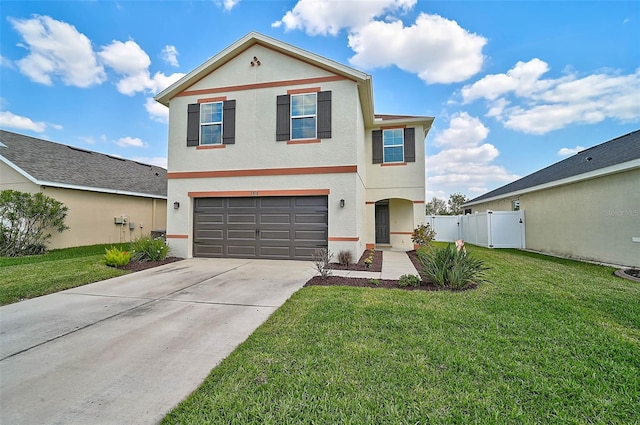 view of front of home with a garage, fence, concrete driveway, stucco siding, and a front yard