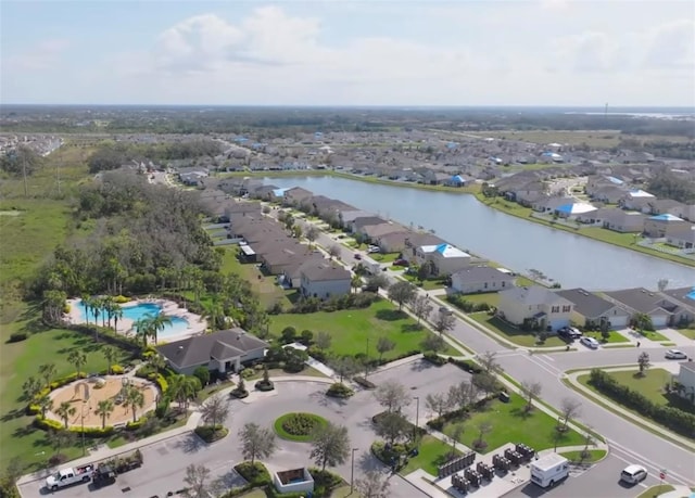 birds eye view of property featuring a residential view and a water view