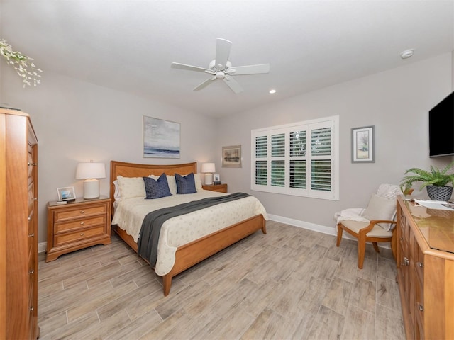 bedroom featuring light wood finished floors, recessed lighting, ceiling fan, and baseboards