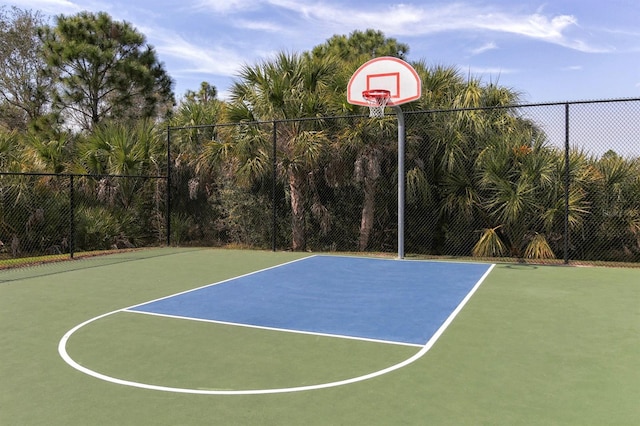 view of sport court featuring community basketball court and fence