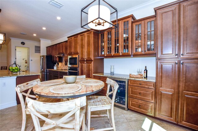 dining room with visible vents, a notable chandelier, wine cooler, light tile patterned flooring, and crown molding