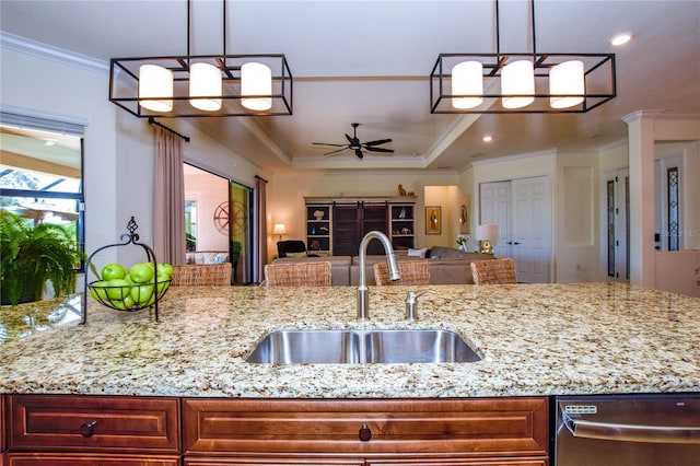 kitchen with crown molding, open floor plan, dishwasher, a ceiling fan, and a sink