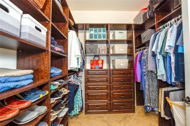 walk in closet with light tile patterned flooring and visible vents