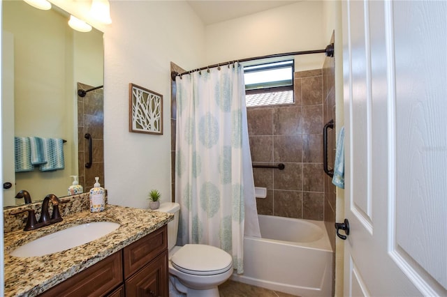 bathroom featuring toilet, shower / bath combo, and vanity