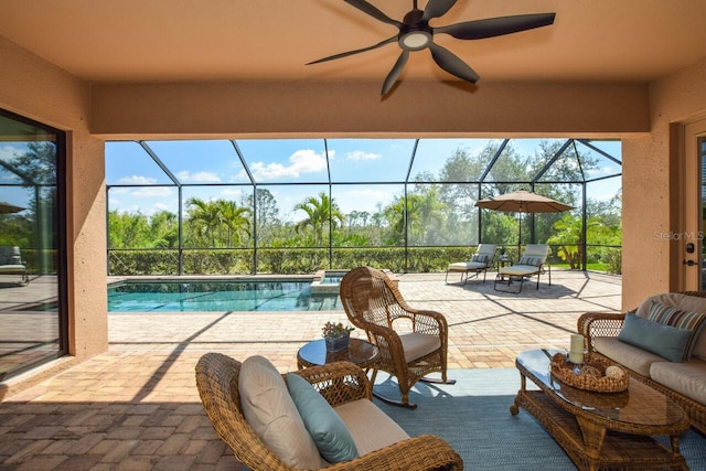 view of patio featuring outdoor lounge area, a lanai, a ceiling fan, and an outdoor pool