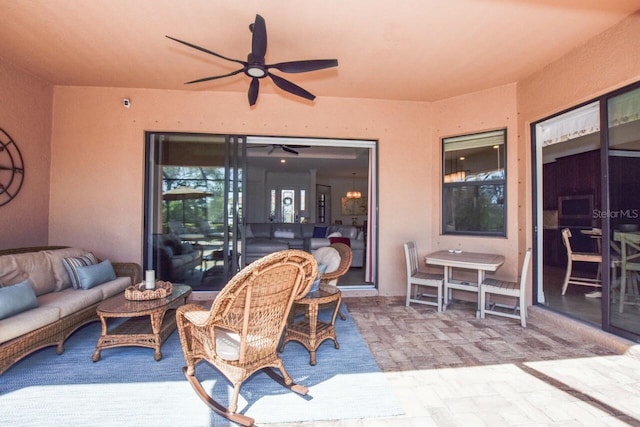 view of patio featuring an outdoor hangout area and a ceiling fan